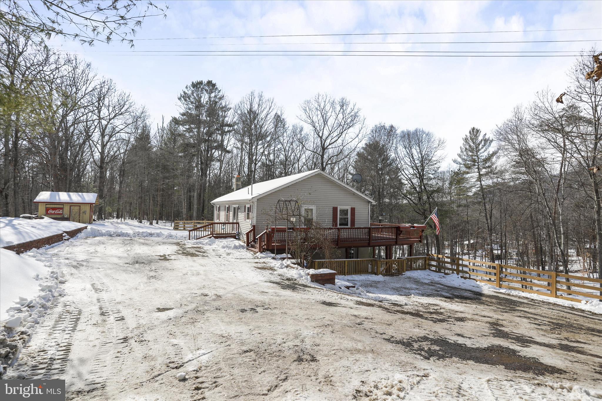 444 Castleton Ford Road Castleton, VA 22716 - Photo 3 of 64 a view of a house with a yard covered in snow