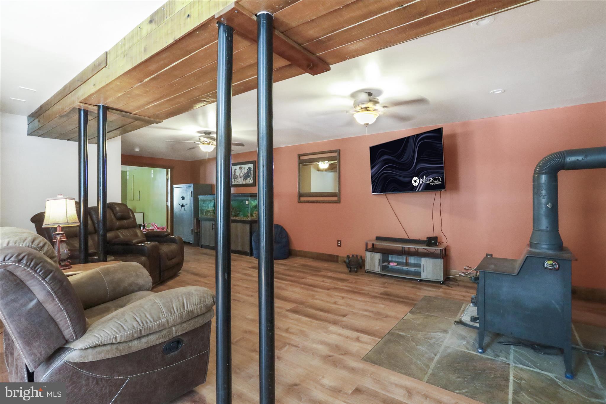 444 Castleton Ford Road Castleton, VA 22716 - Photo 32 of 64 a living room with furniture and a flat screen tv