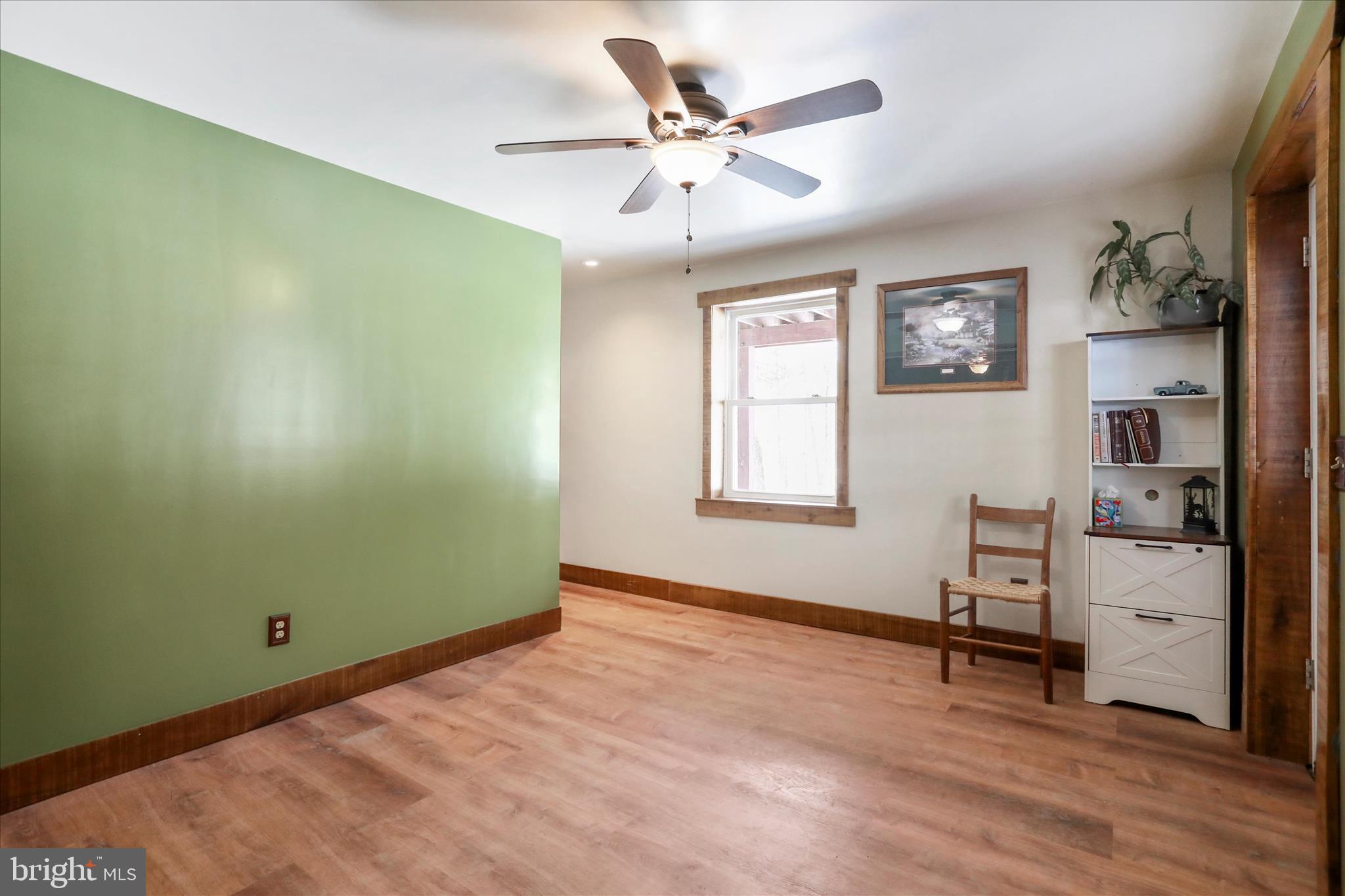 444 Castleton Ford Road Castleton, VA 22716 - Photo 37 of 64 a view of room with hardwood floor and a ceiling fan