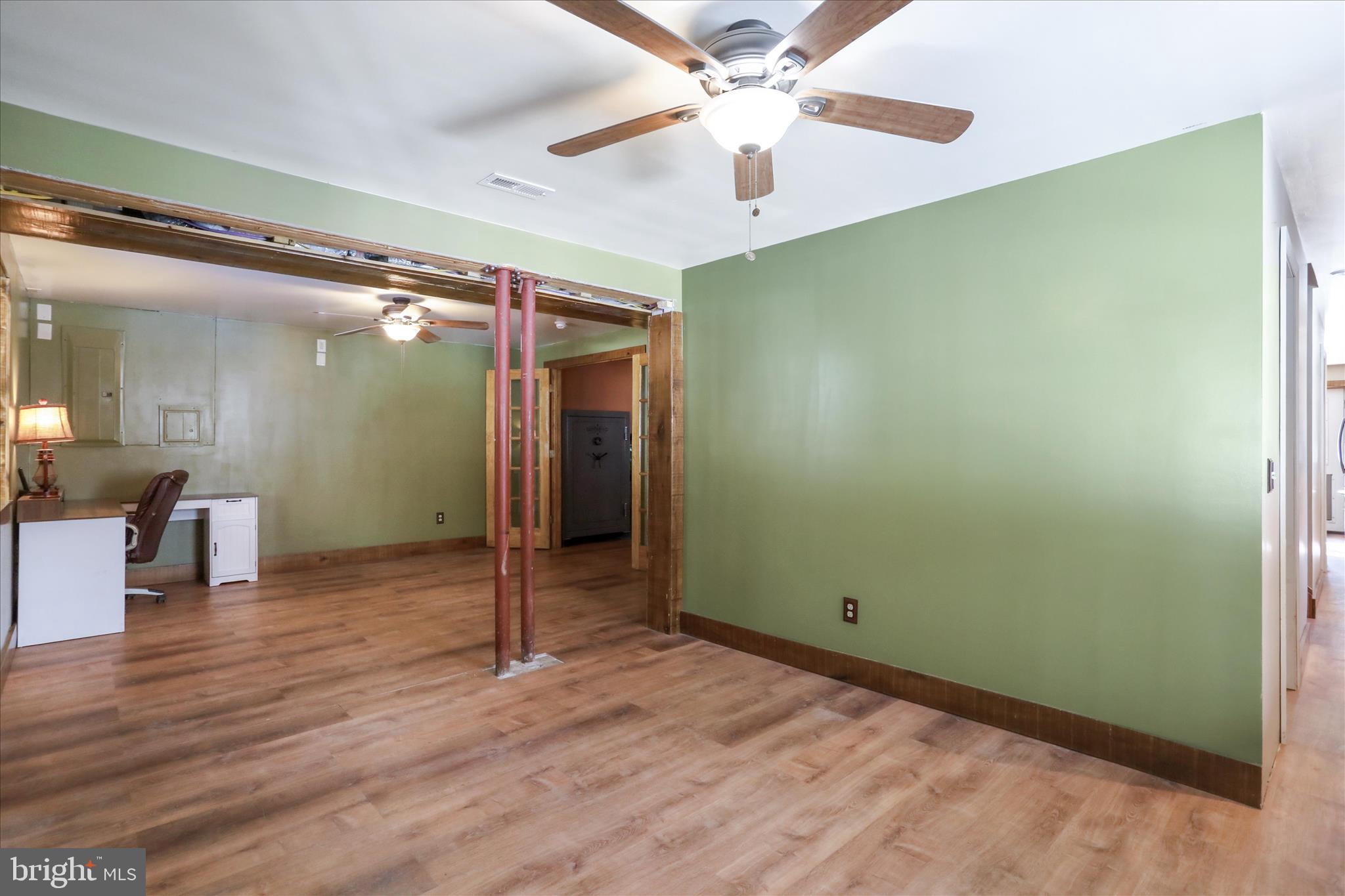 444 Castleton Ford Road Castleton, VA 22716 - Photo 40 of 64 wooden floor in an empty room with a window