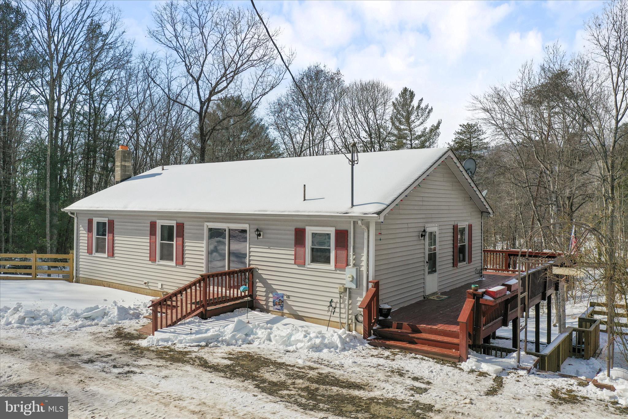444 Castleton Ford Road Castleton, VA 22716 - Photo 4 of 64 a view of a house with a yard chairs and floor to ceiling window