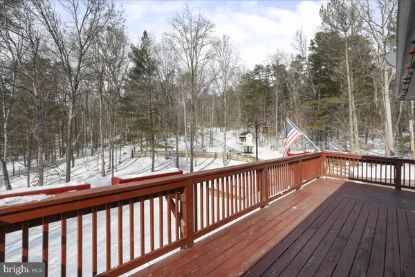 a view of house with outdoor seating area