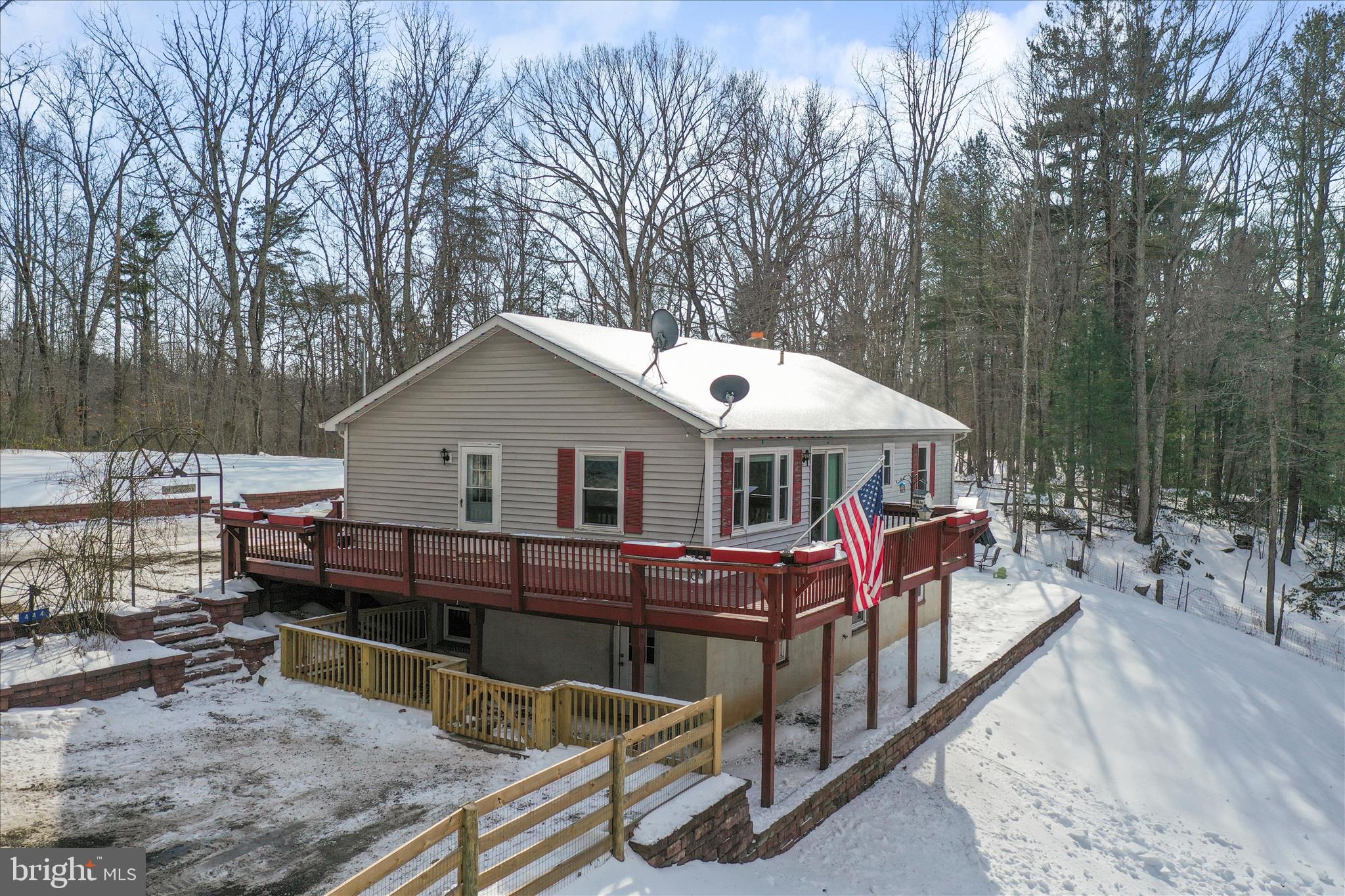444 Castleton Ford Road Castleton, VA 22716 - Photo 48 of 64 a view of a house with wooden deck and trees