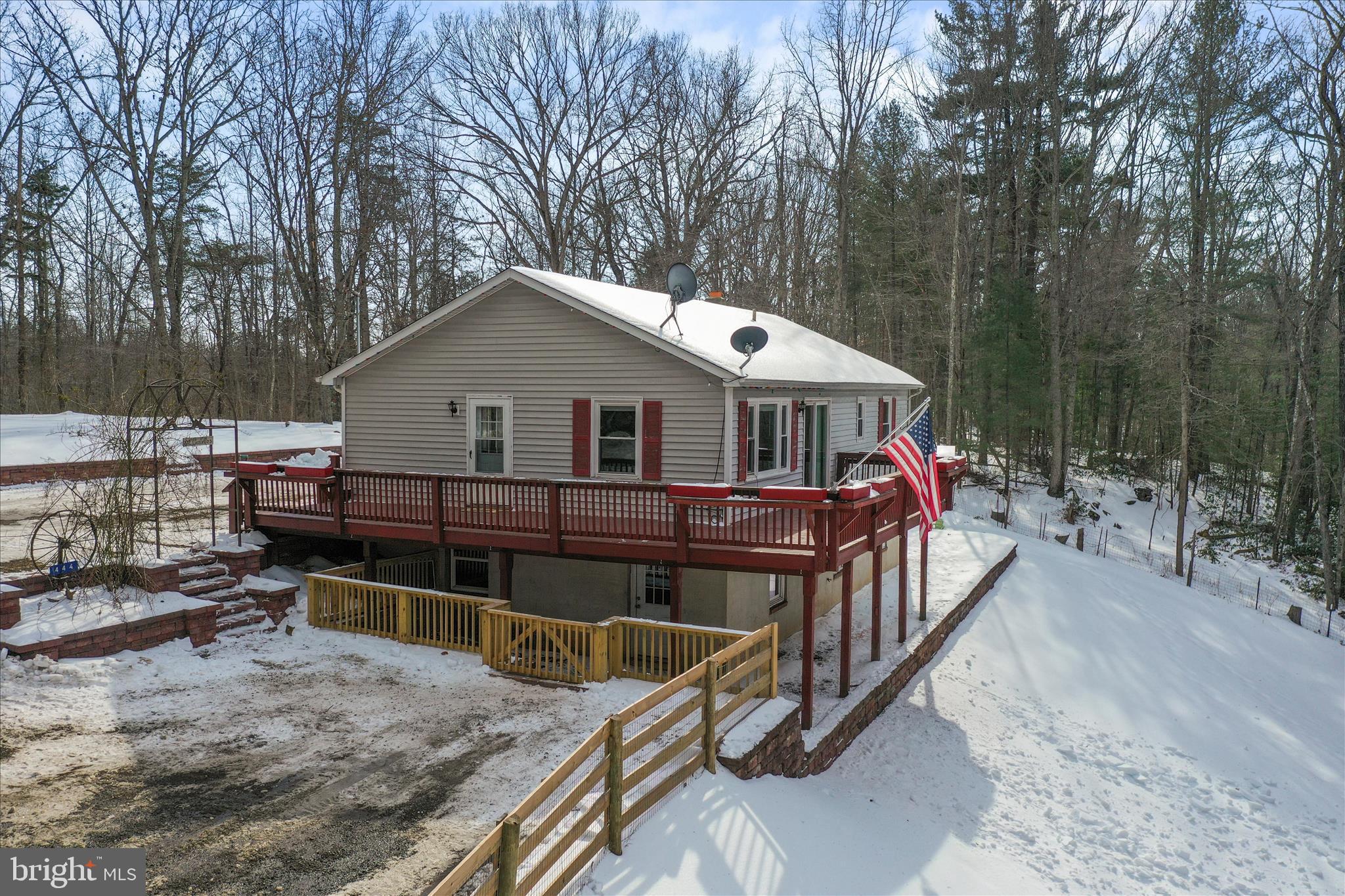 444 Castleton Ford Road Castleton, VA 22716 - Photo 63 of 64 a view of a house with a wooden deck and a wooden fence