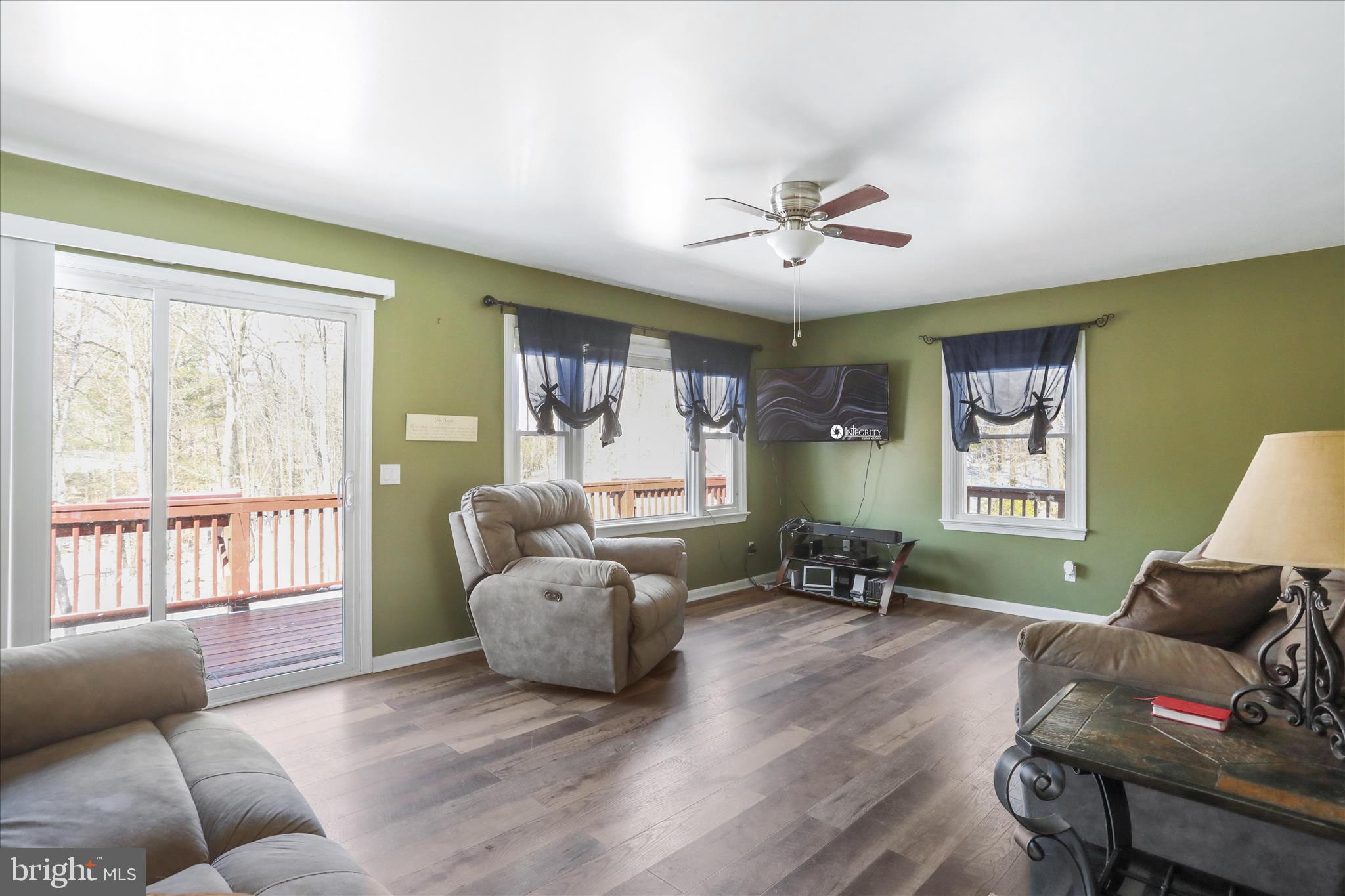 444 Castleton Ford Road Castleton, VA 22716 - Photo 8 of 64 a living room with furniture and a large window