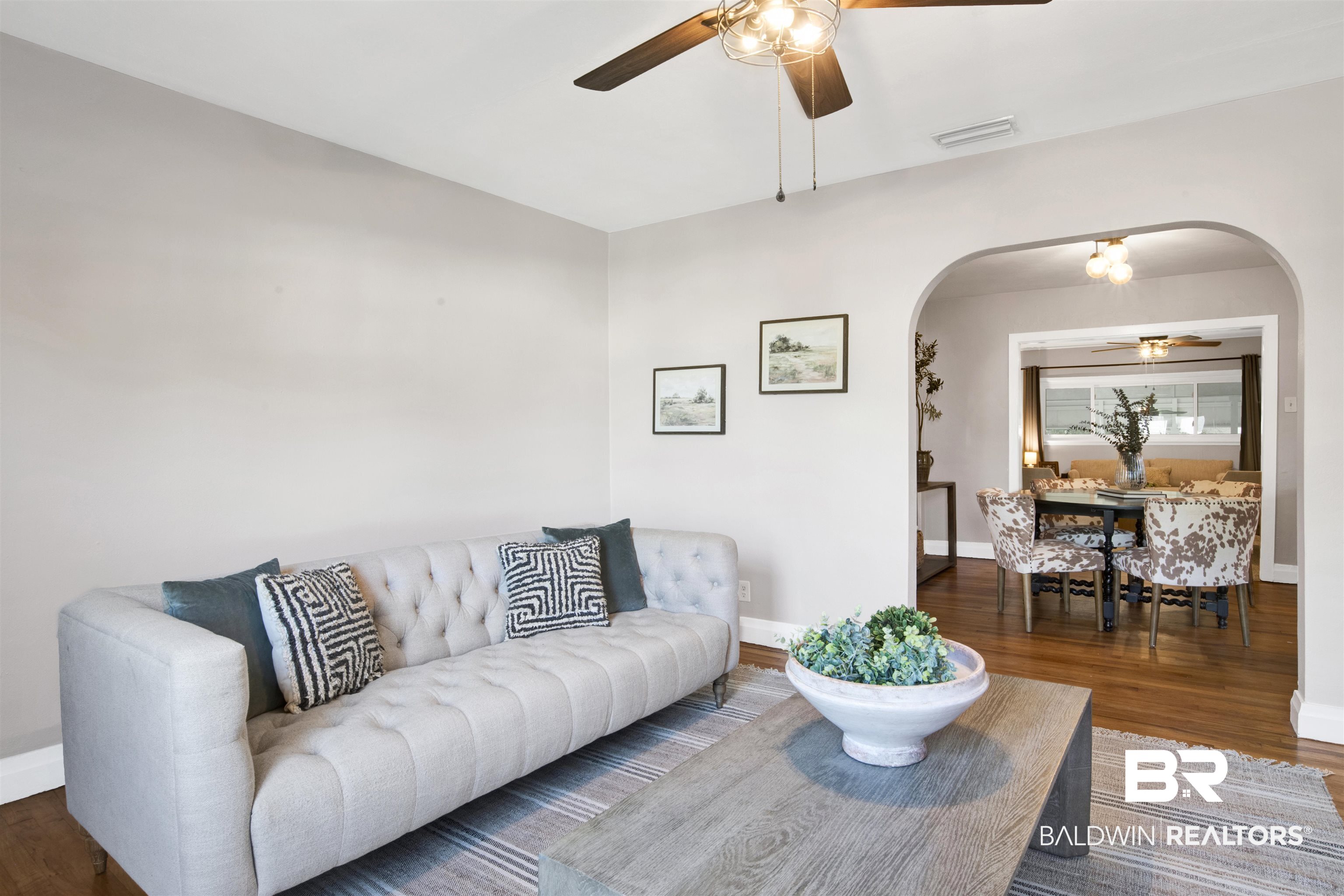 160 Emogene Place Mobile, AL 36606 - Photo 5 of 32 Living room with ceiling fan, wood finished floors, and arched walkways