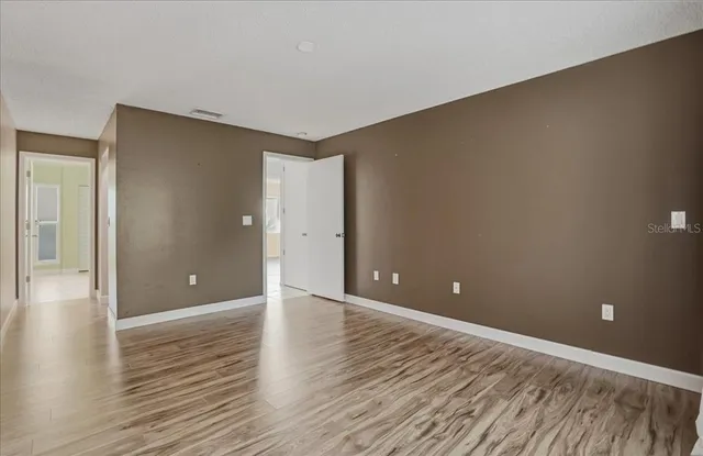a view of a backyard with sitting area