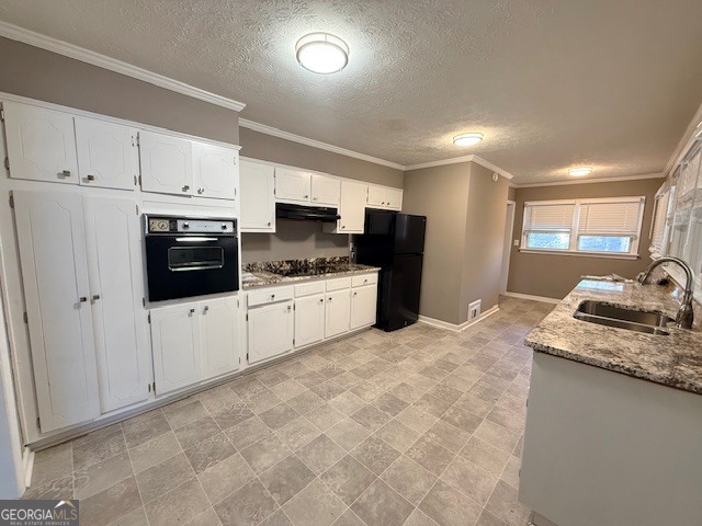 1397 Jewell Court Mableton, GA 30126 - Photo 19 of 27 a kitchen with granite countertop a sink a stove and cabinets