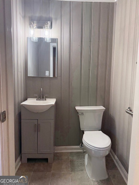 1397 Jewell Court Mableton, GA 30126 - Photo 25 of 27 a bathroom with a toilet sink and mirror