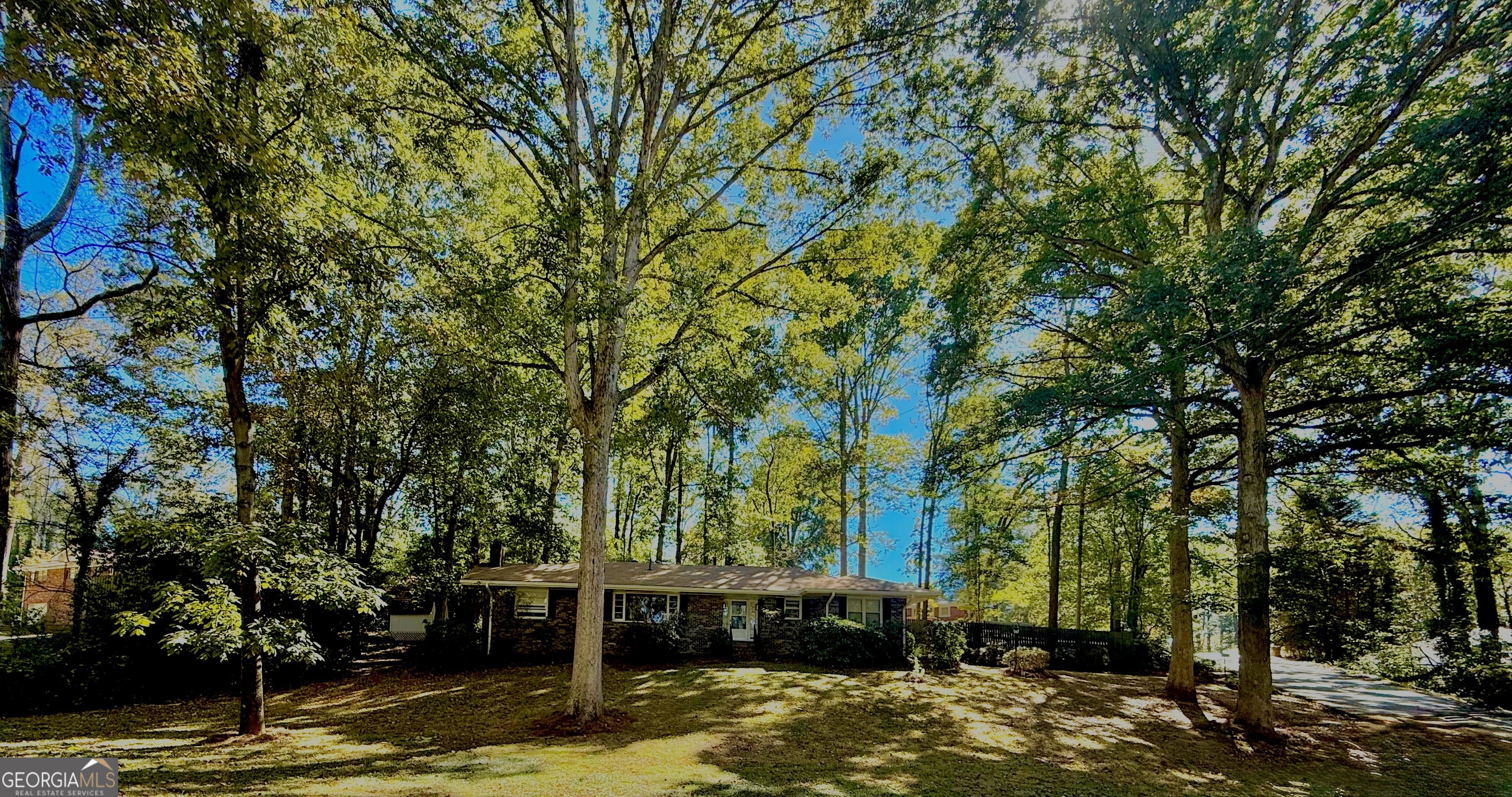 1397 Jewell Court Mableton, GA 30126 - Photo 27 of 27 a view of a backyard with large trees
