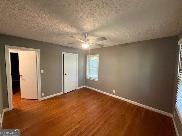 1397 Jewell Court Mableton, GA 30126 - Photo 6 of 27 a view of an empty room with window and wooden floor