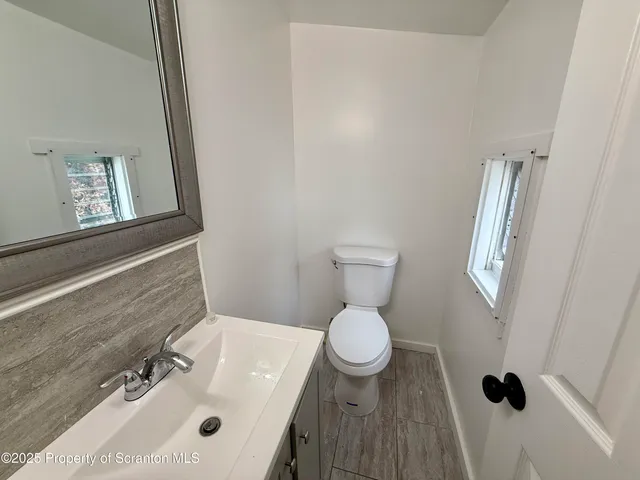 a bathroom with a sink and a toilet