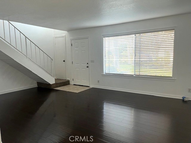 641 Buckboard Court Brea, CA 92821 - Photo 2 of 10 a view of an empty room with wooden floor and a window
