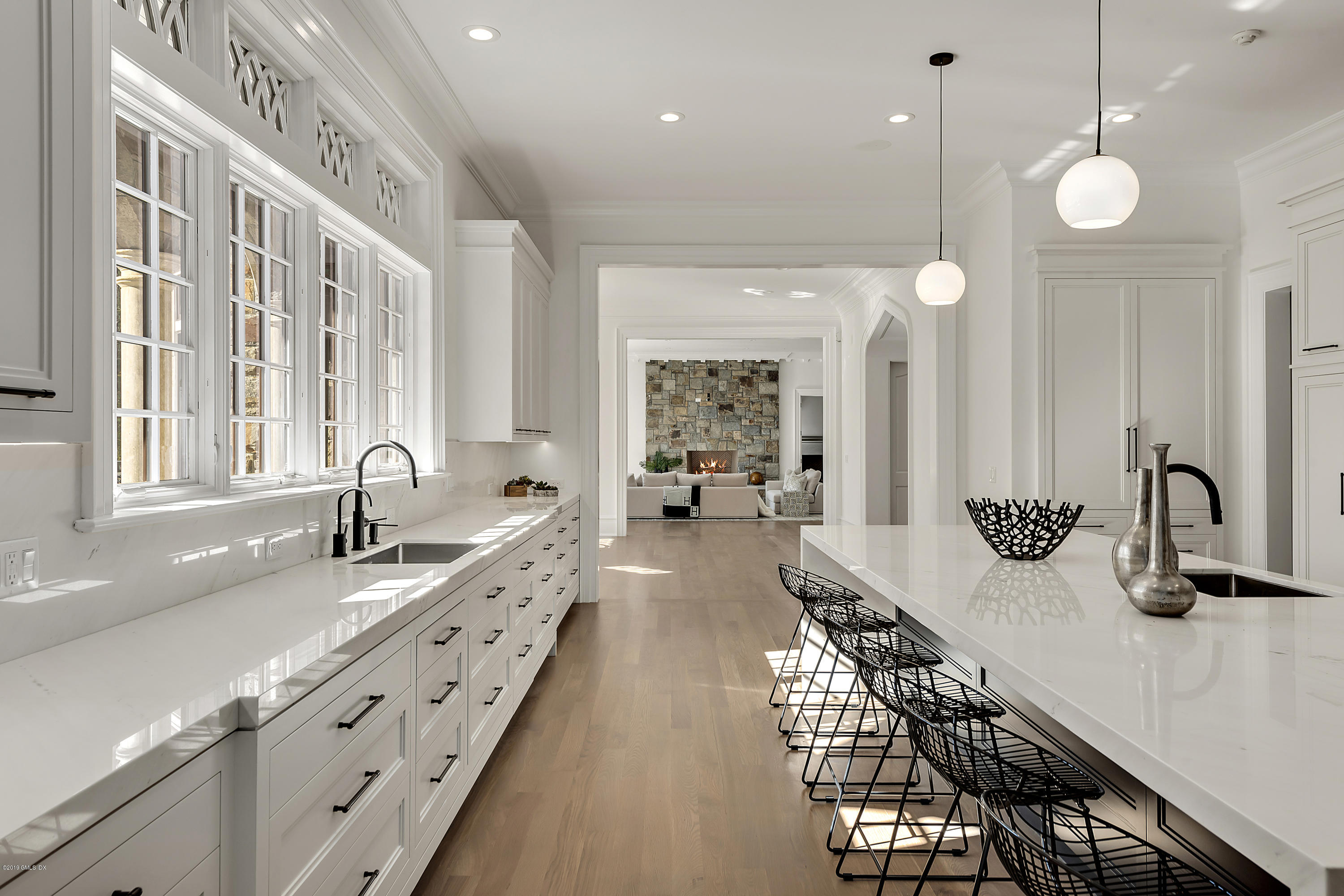 7 Loch Lane Greenwich, CT 06830 - Photo 14 of 41 a kitchen with counter top space and a sink