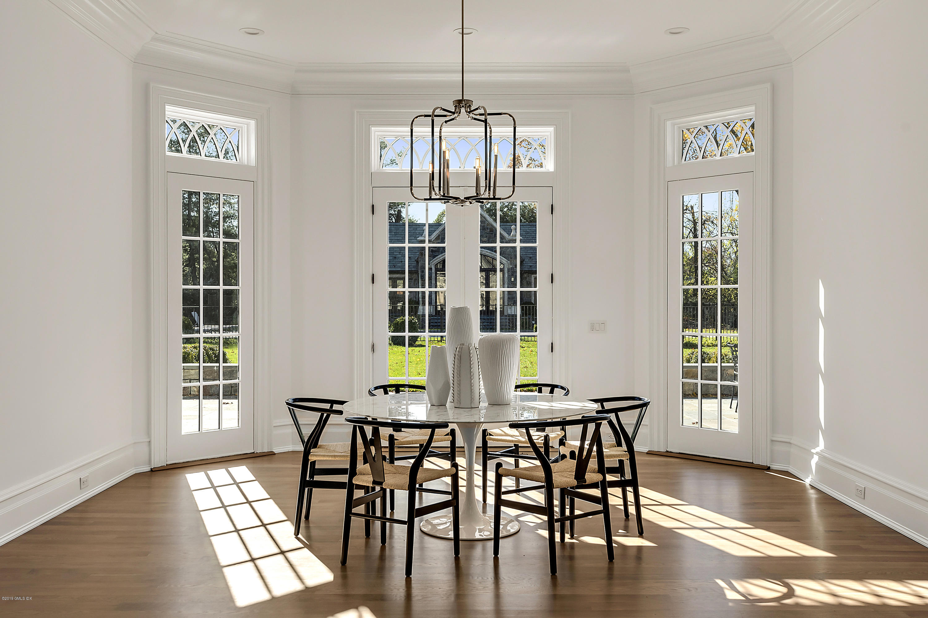 7 Loch Lane Greenwich, CT 06830 - Photo 16 of 41 a view of a dining room with furniture window and wooden floor