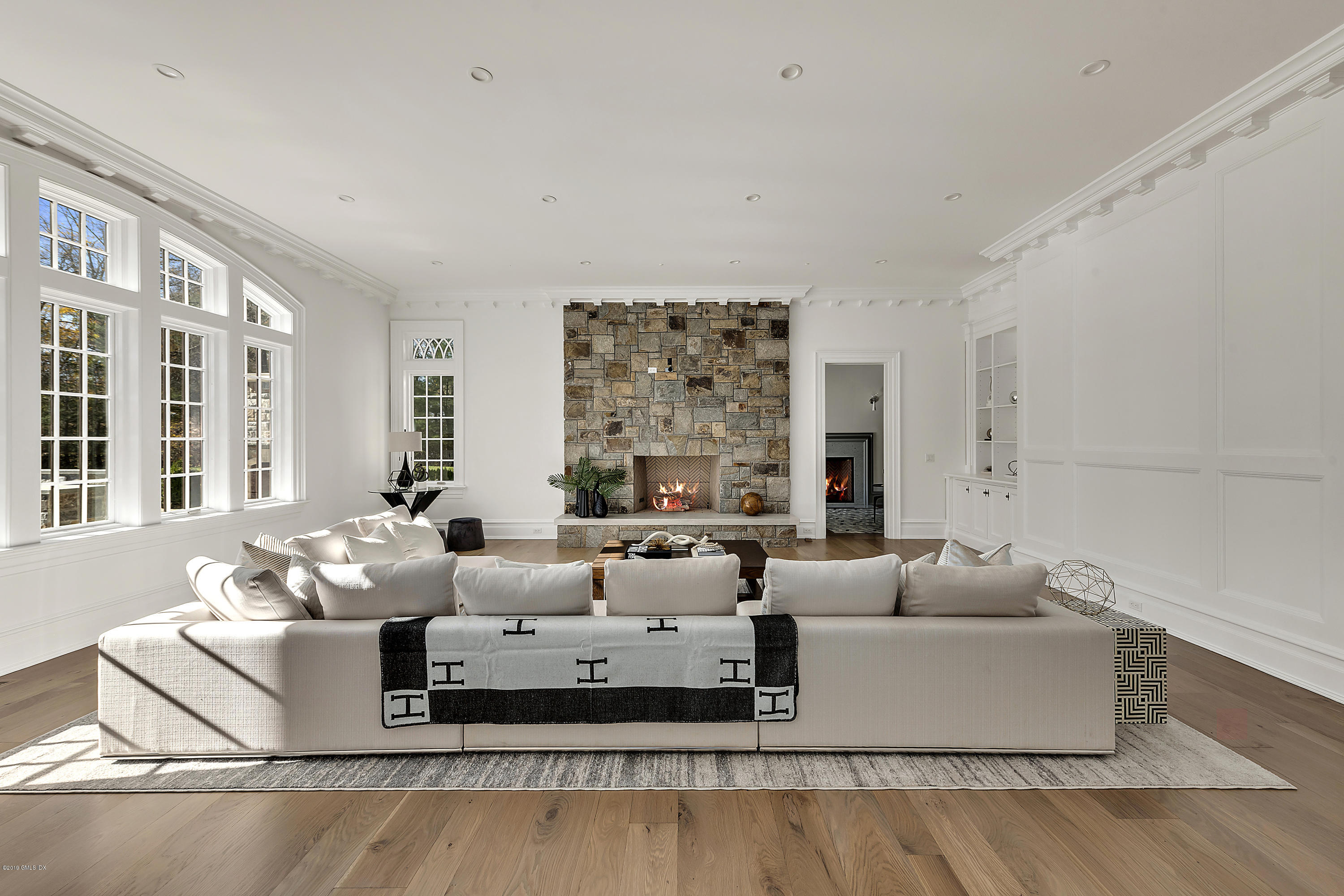 7 Loch Lane Greenwich, CT 06830 - Photo 18 of 41 a living room with furniture and large windows