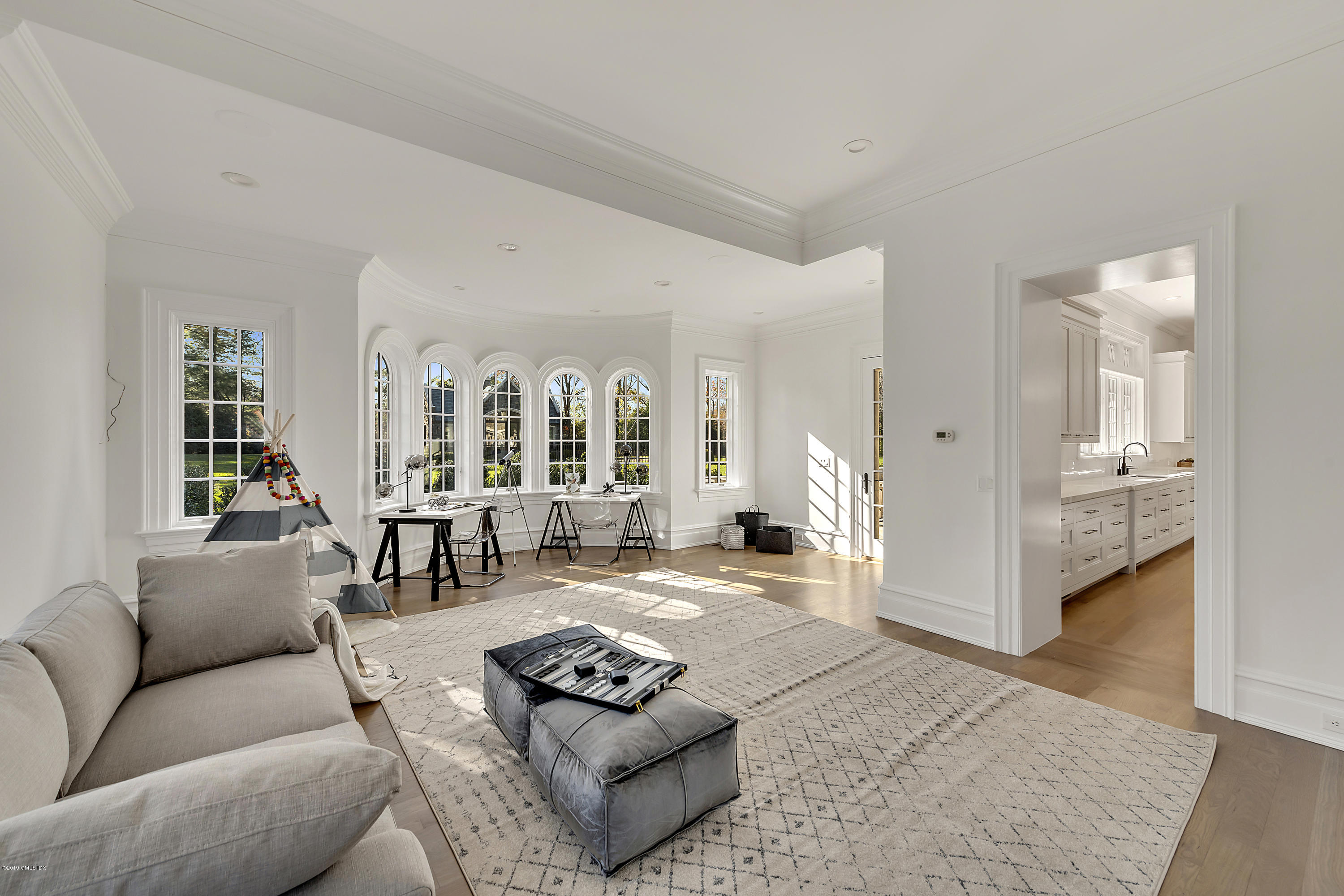 7 Loch Lane Greenwich, CT 06830 - Photo 22 of 41 a living room with furniture couches and a dining table with wooden floor