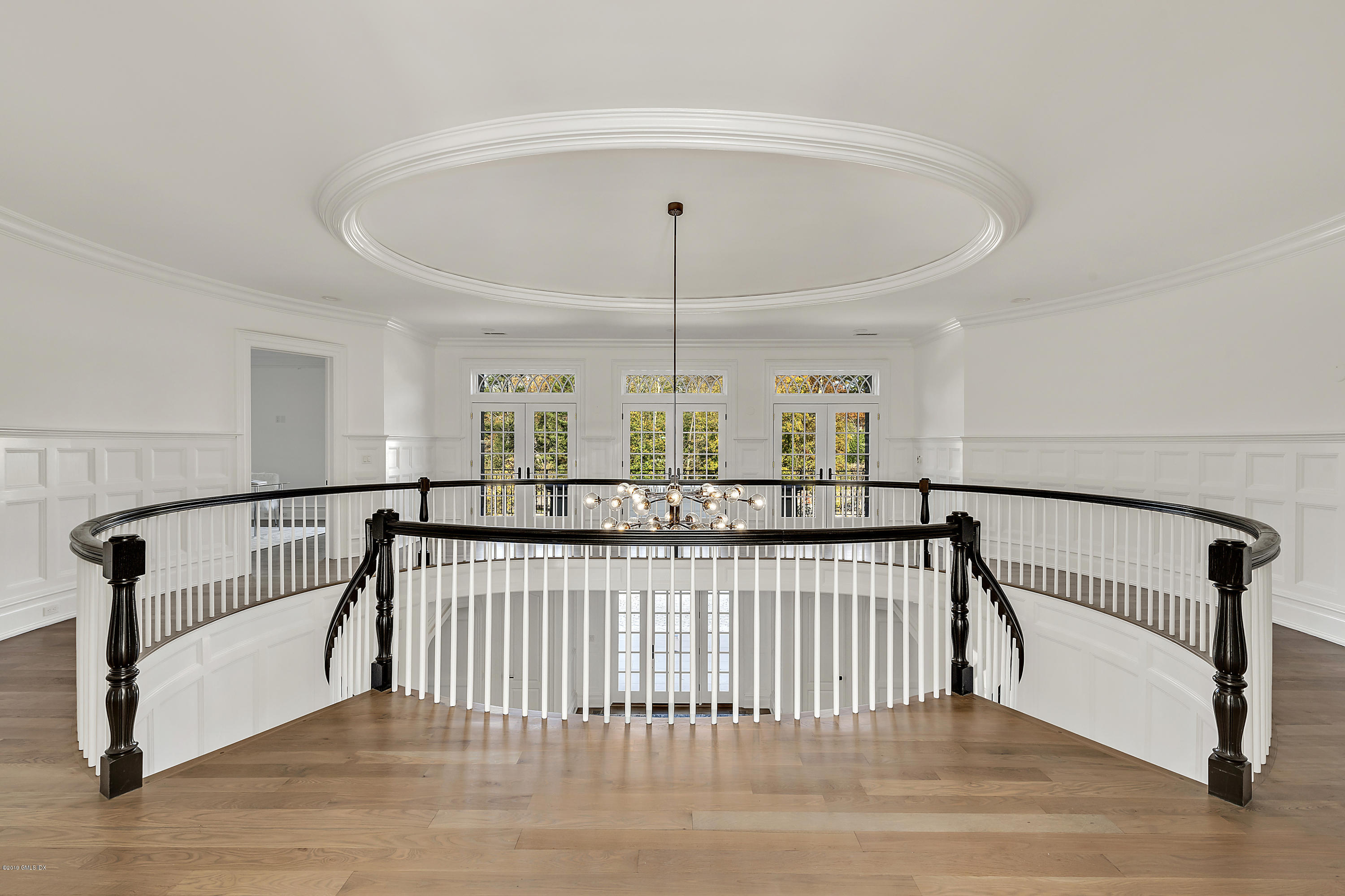 7 Loch Lane Greenwich, CT 06830 - Photo 24 of 41 a view of staircase with a floor to ceiling window and stairs