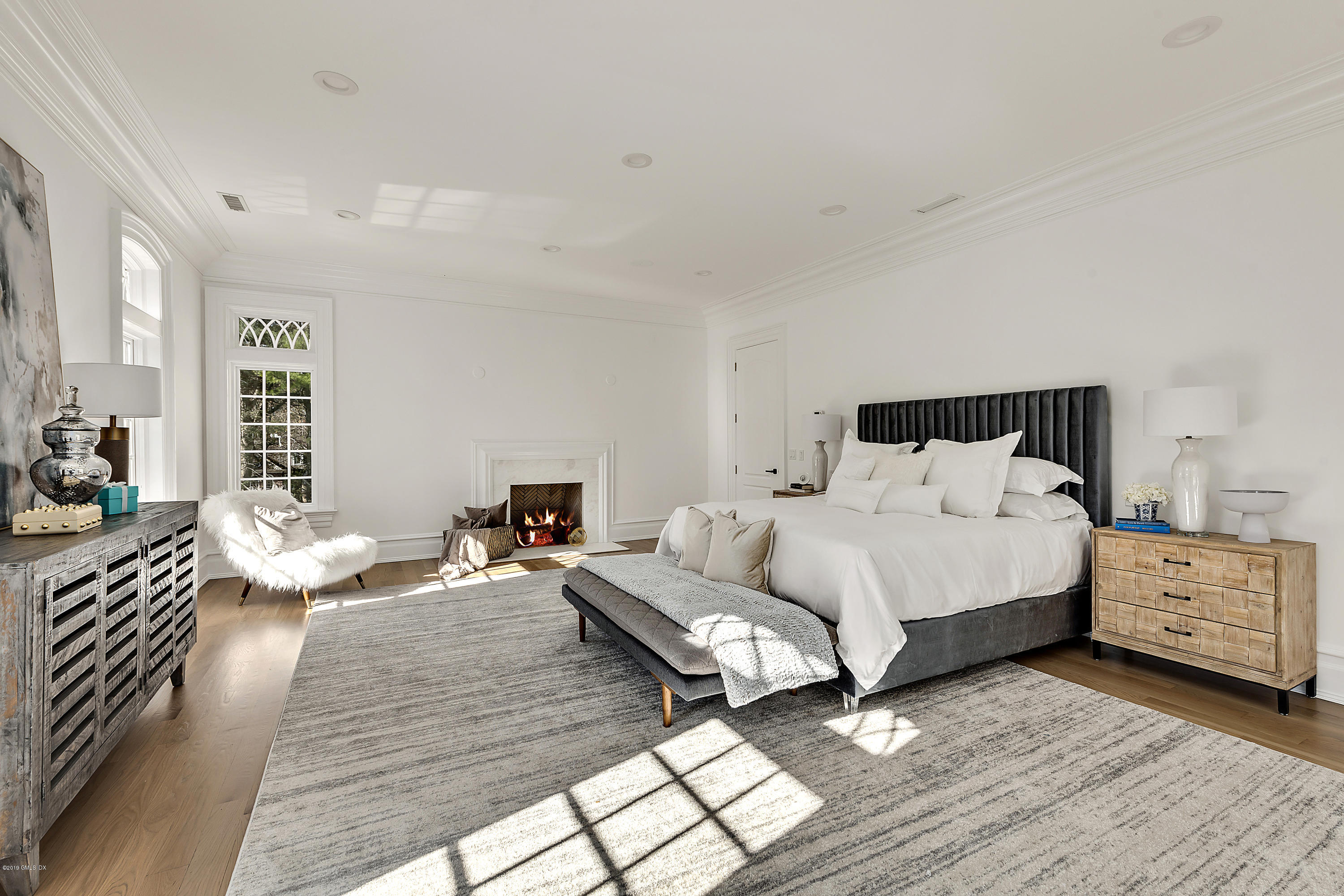 7 Loch Lane Greenwich, CT 06830 - Photo 25 of 41 a bedroom with furniture and wooden floor