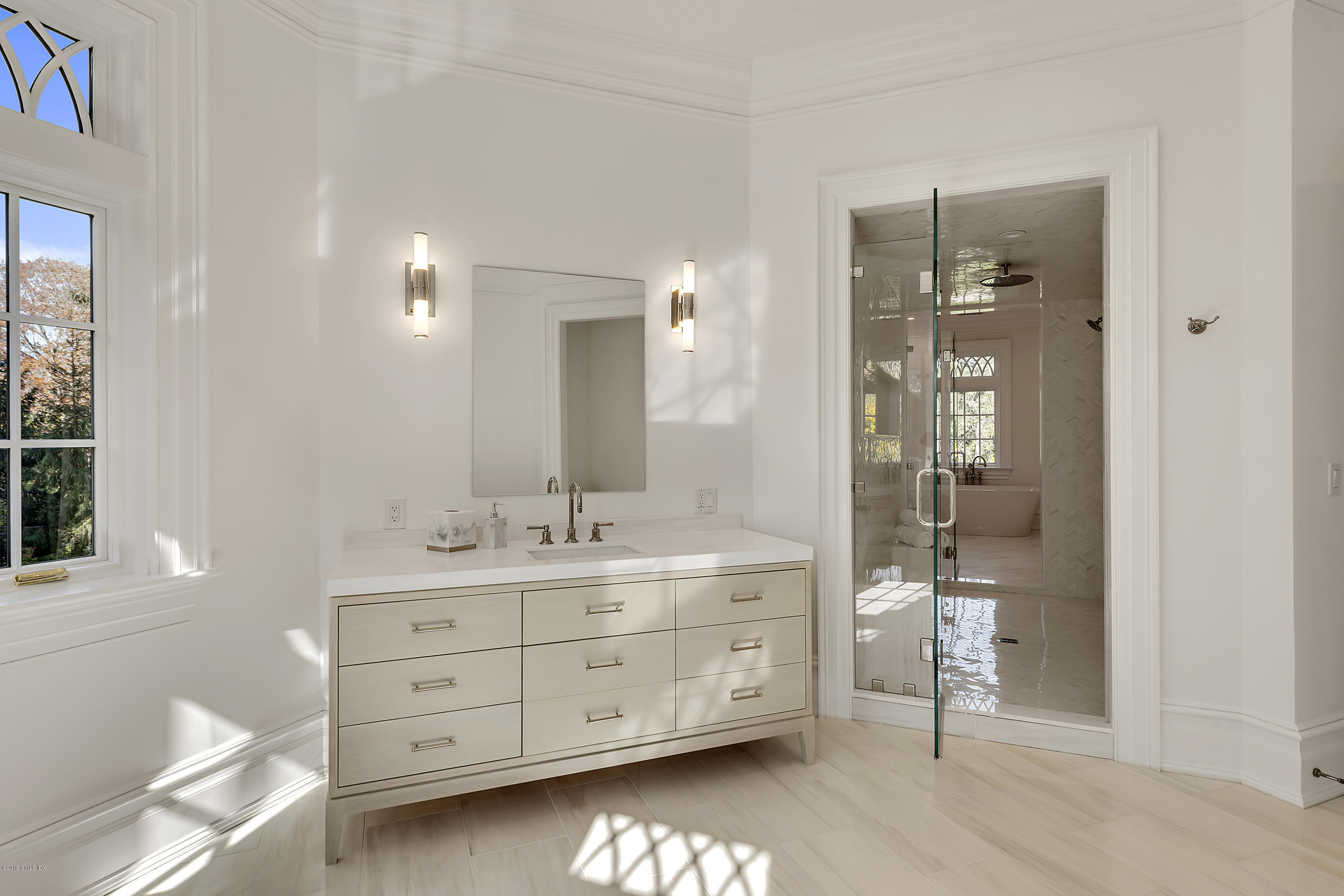 7 Loch Lane Greenwich, CT 06830 - Photo 27 of 41 a bathroom with a double vanity sink toilet a mirror and shower