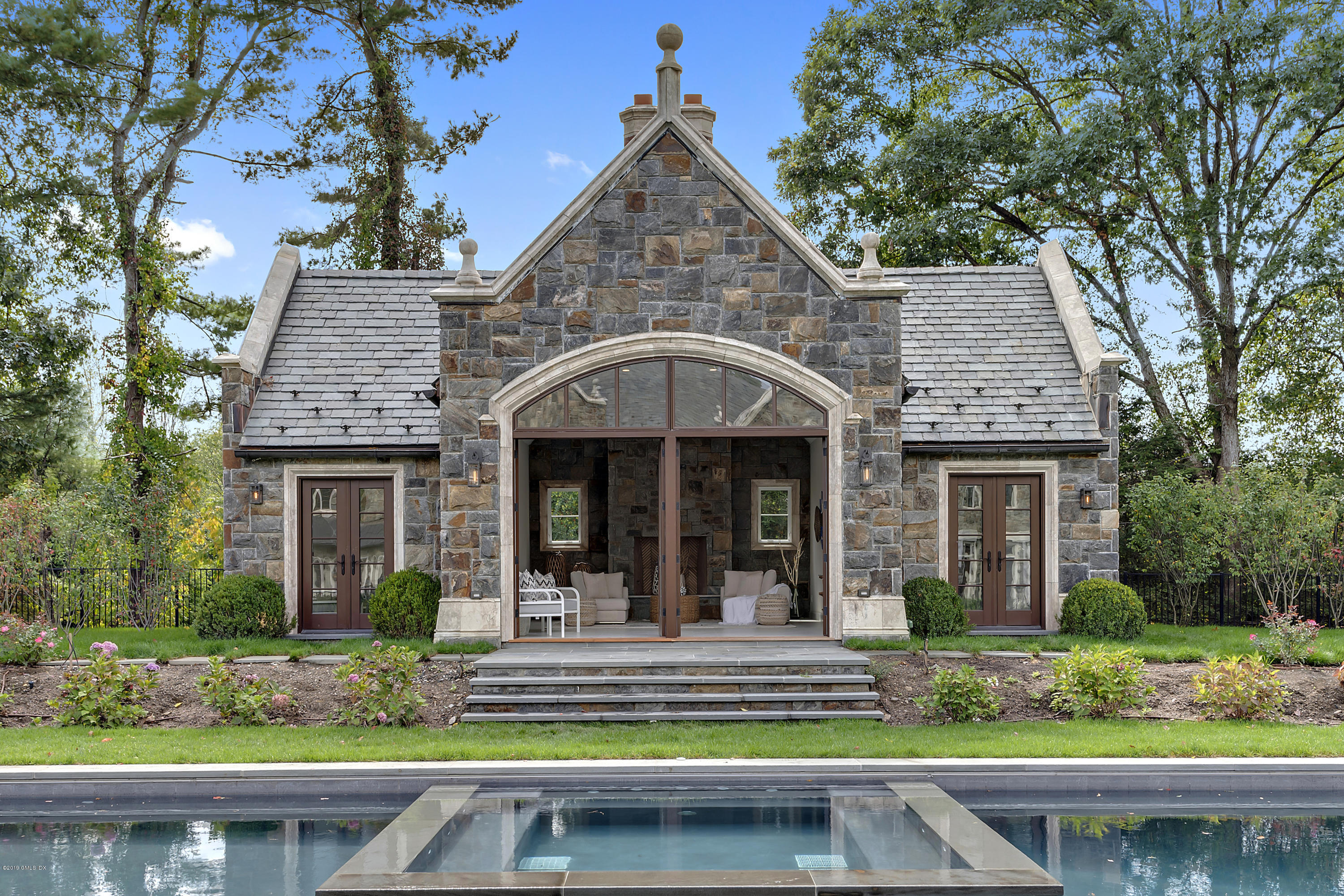 7 Loch Lane Greenwich, CT 06830 - Photo 31 of 41 a front view of a house with garden