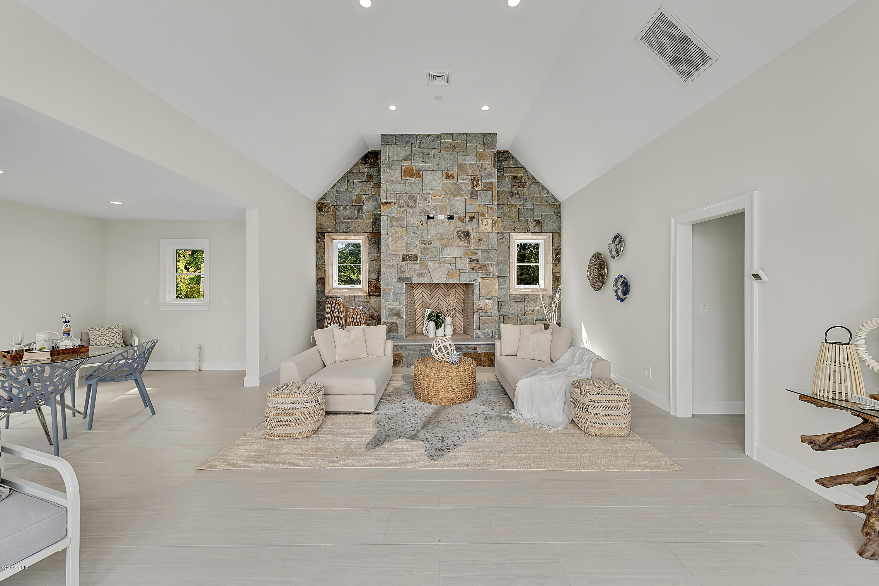 7 Loch Lane Greenwich, CT 06830 - Photo 33 of 41 a living room with furniture and a chandelier