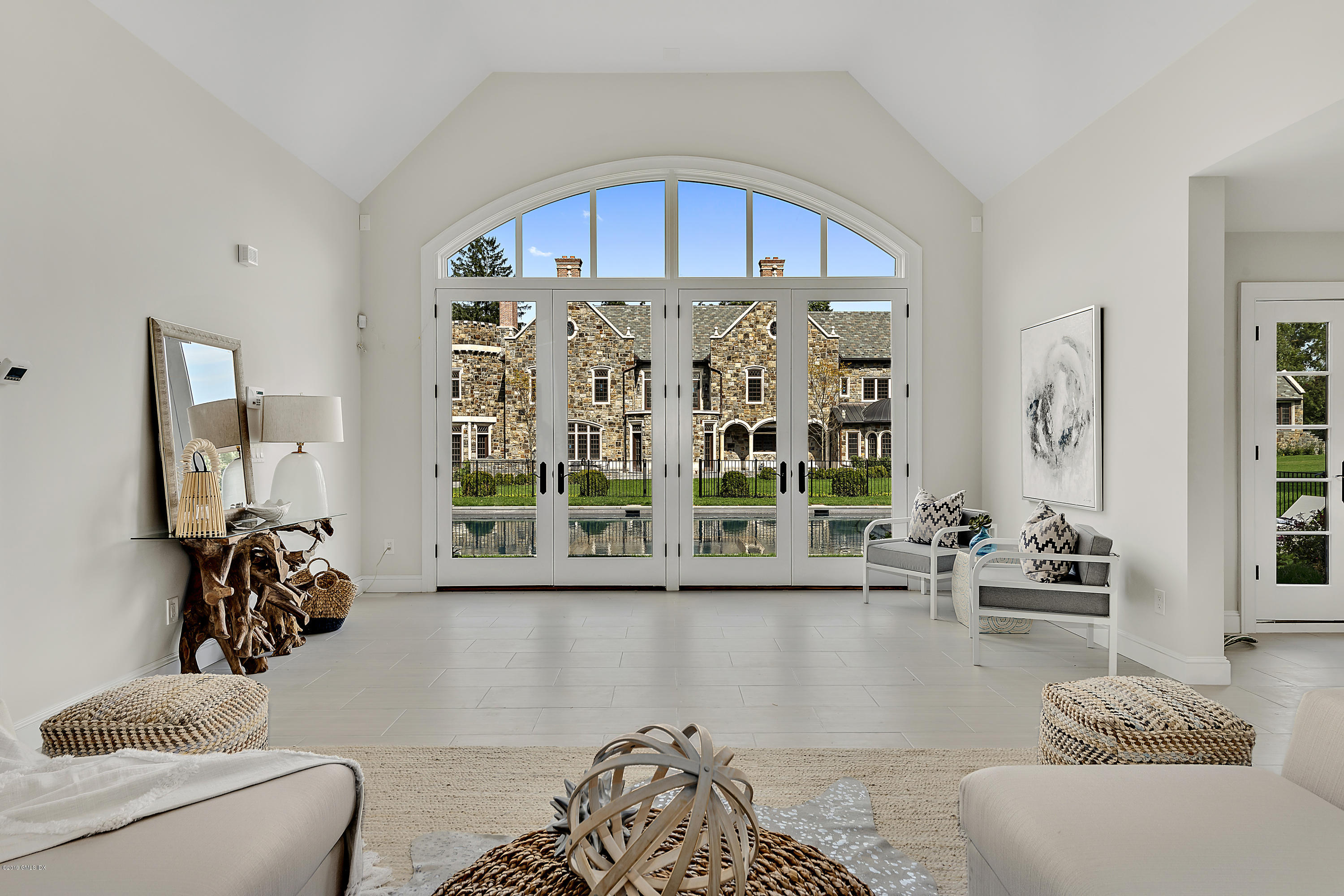 7 Loch Lane Greenwich, CT 06830 - Photo 35 of 41 a living room with furniture and a large window