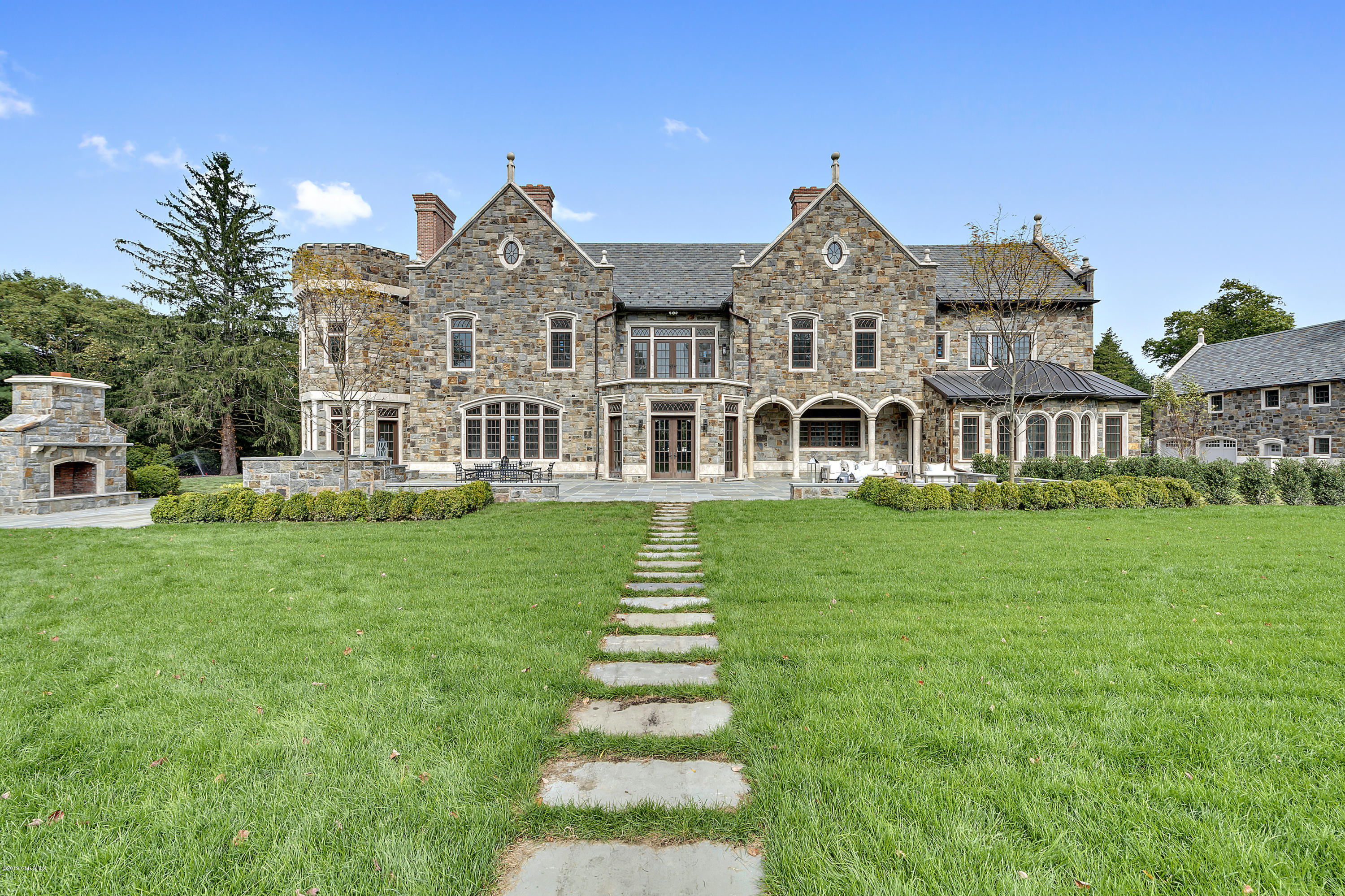 7 Loch Lane Greenwich, CT 06830 - Photo 5 of 41 front view of a house with a yard