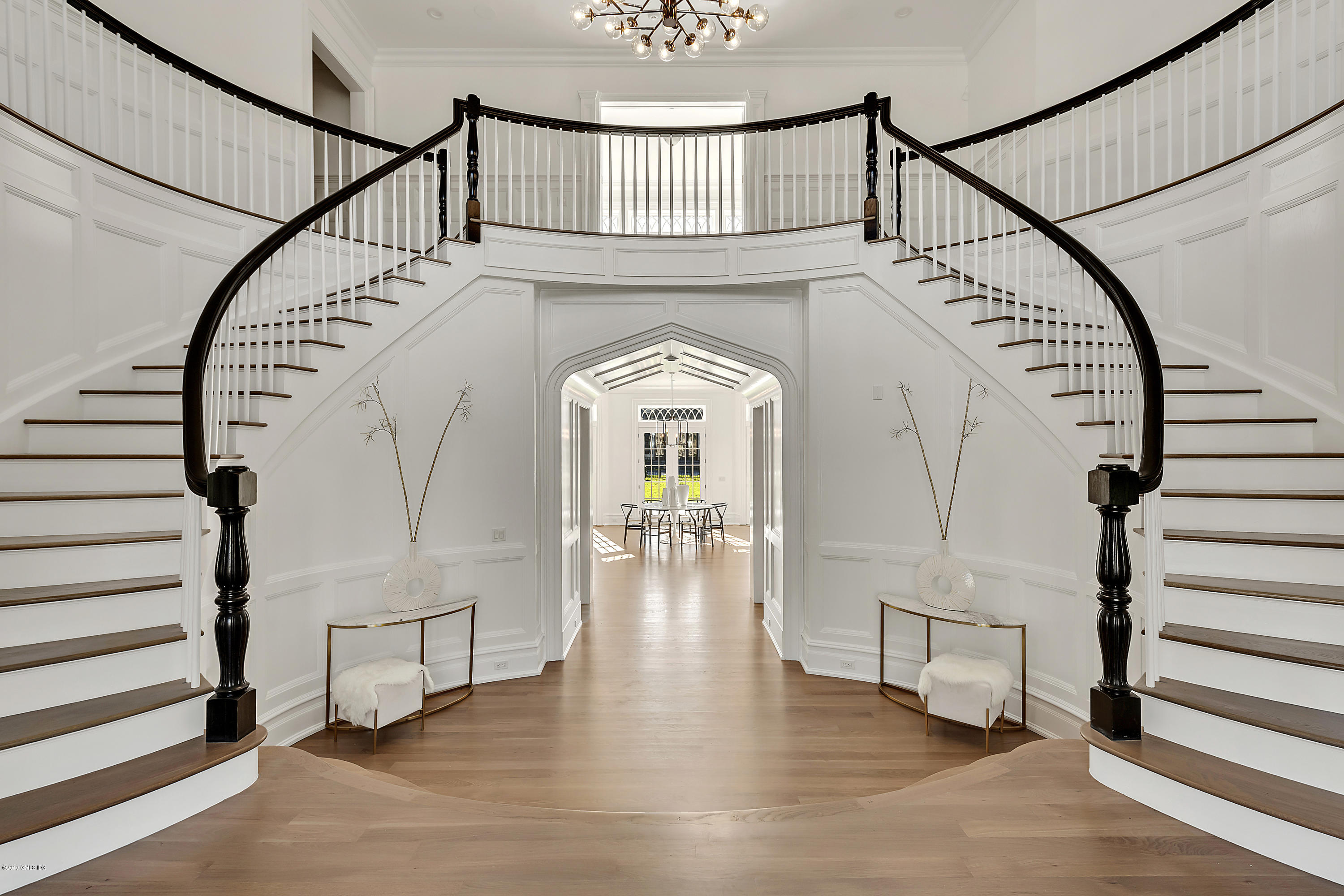 7 Loch Lane Greenwich, CT 06830 - Photo 7 of 41 a view of staircase with wooden floor and a chandelier