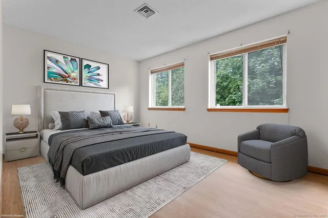 a bedroom with bed and a couch