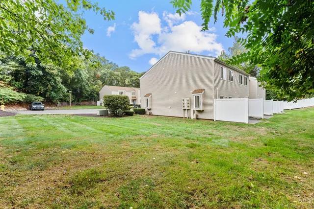 a backyard of a house with outdoor seating