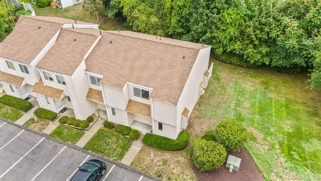 front view of a house with a garden