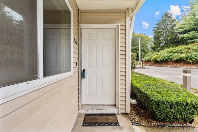 a view of a door and a window