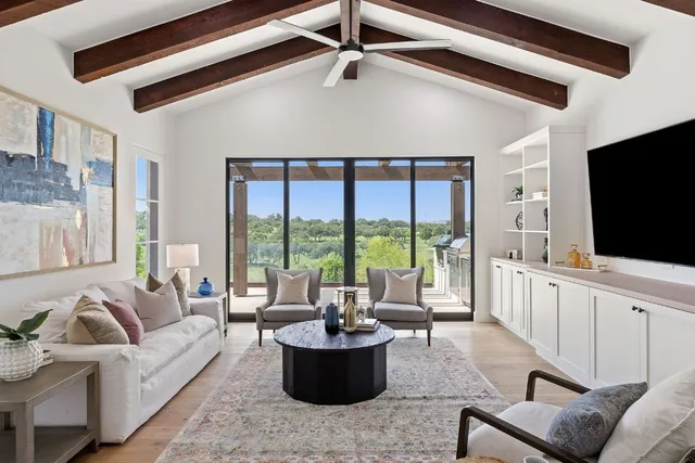 a view of living room and kitchen with furniture wooden floor