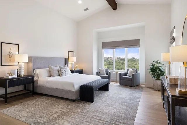 a kitchen with stainless steel appliances kitchen island granite countertop a sink stove and cabinets