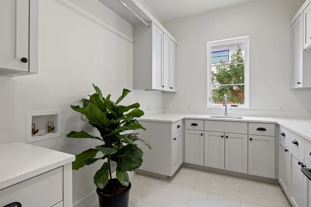 a work room with furniture and a window