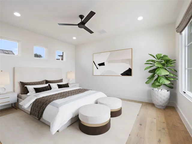 a living room with furniture potted plant and a window