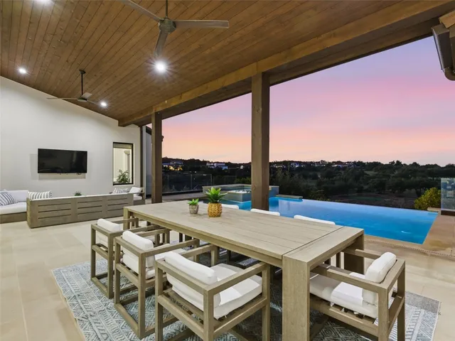 an aerial view of houses with a yard