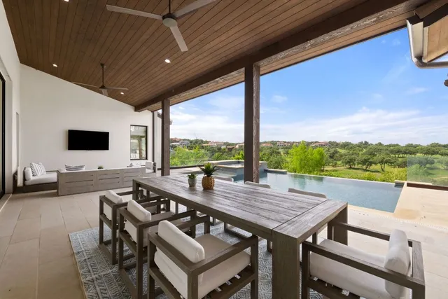 a view of an outdoor dining space with furniture