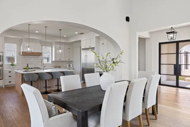 a view of a dining room with furniture and wooden floor