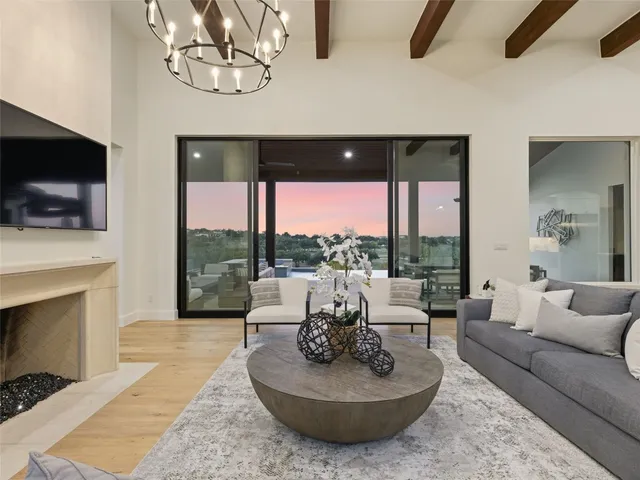 a living room with fireplace furniture and a flat screen tv