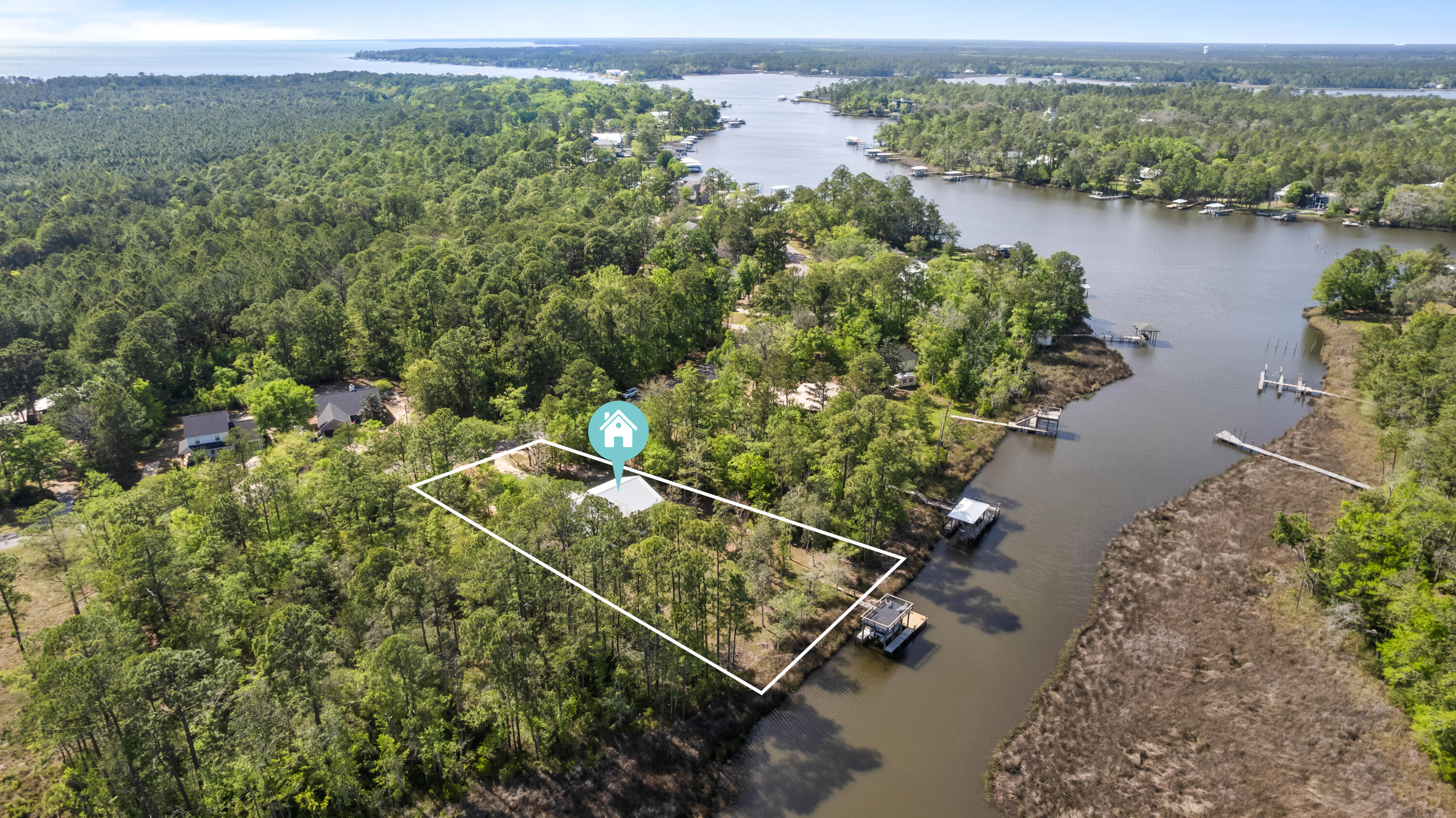 528 Bay Grove Road Freeport, FL 32439 - Photo 63 of 68 an aerial view of a house with a yard and lake view