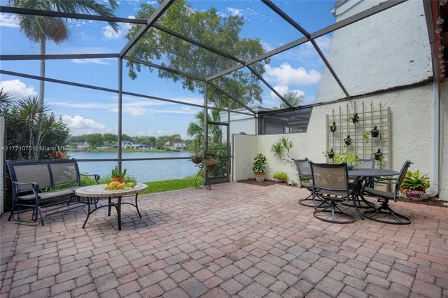 a view of chairs and tables in the patio