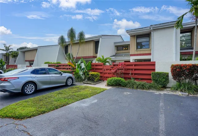 a car parked in front of a house