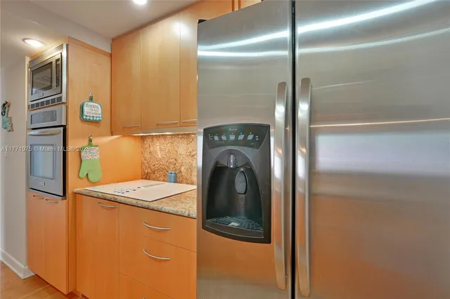 a close view of a refrigerator a washer and dryer