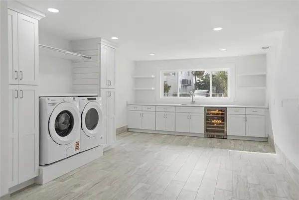 a view of a hallway with washer and dryer