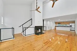a view of a hall with an entryway and a kitchen view