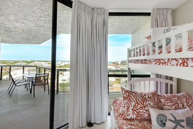 a view of a livingroom with furniture and staircase