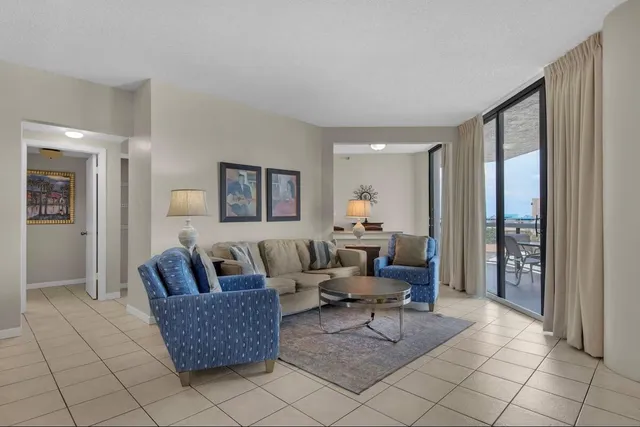a kitchen with granite countertop a sink stove and cabinets
