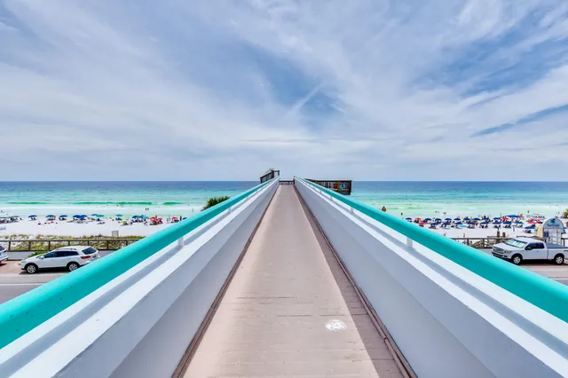 a view of balcony with a large window and wooden floor